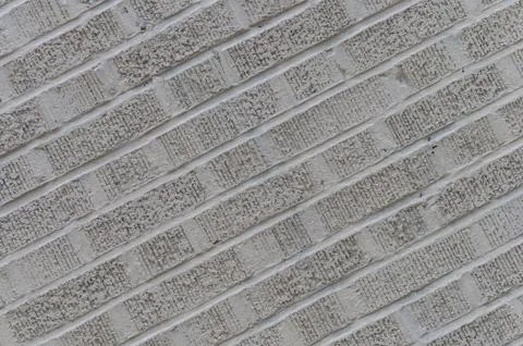 Gray angled brick wall background Stock Photos