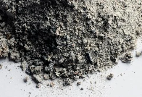 Gray ashes remaining on a white background Stock Photos