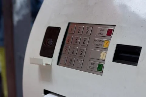 Gray ATM machine with keyboard and contactless reader Stock Photos