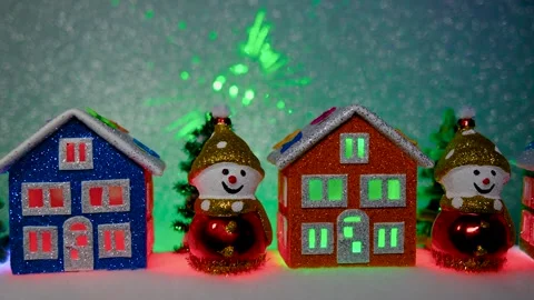On a gray background among houses, Christmas trees and snowmen Stock Footage 311856441