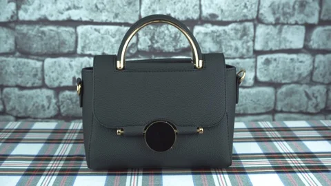 Gray background and black bag Stock Footage 103261528