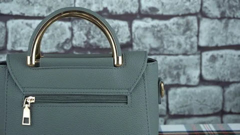 Gray background and gray bag closeup Stock Footage 103264073