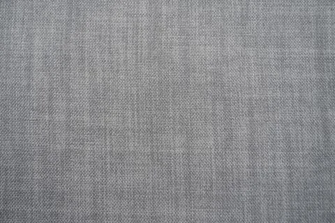Gray background fabric texture. A piece of woolen cloth is neatly laid out on Stock Photos