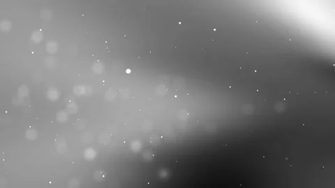 Gray background features small bright specks and blurry circles. Stock Footage 317127515