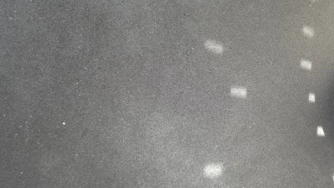 Gray background with glare from a disco ball. Texture of Dark Grey Foam Rubber Stock Footage 339330240
