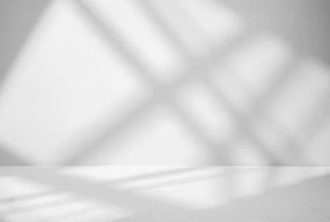 Gray background for product presentation with shadow and light from windows Stock Photos
