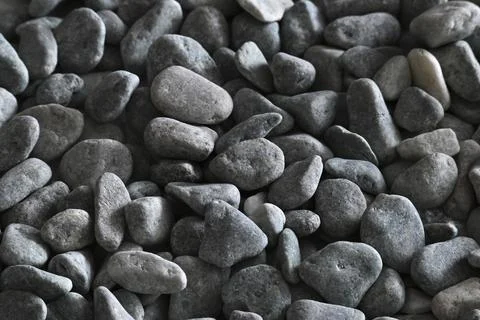 Gray background with small pebbles Stock Photos