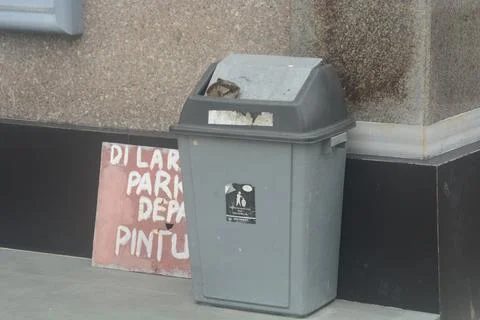Gray bins are placed on the ground to create a clean environment without tras Stock Photos