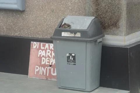 Gray bins are placed on the ground to create a clean environment without tras Stock Photos