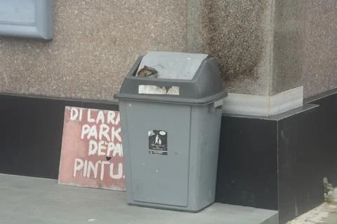 Gray bins are placed on the ground to create a clean environment without tras Stock Photos