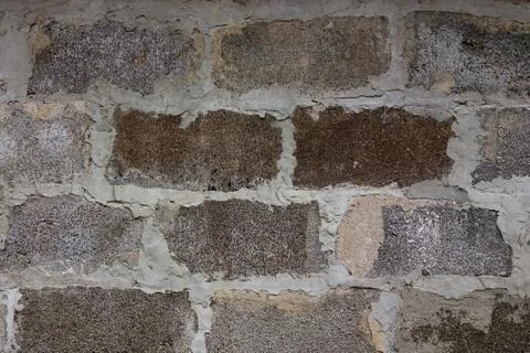 Gray block wall background. Grey textured building exterior surface with roug 스톡 사진