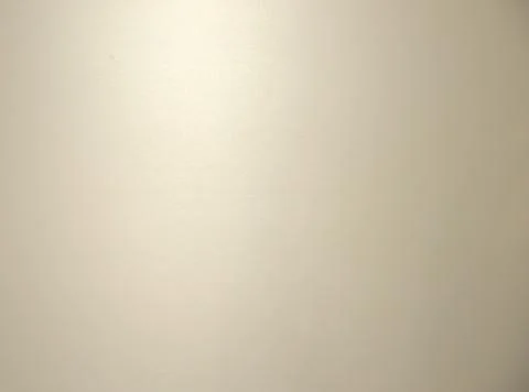 Gray blurred solid color background. Texture, gradient, vignetting, close-up. Stock Photos