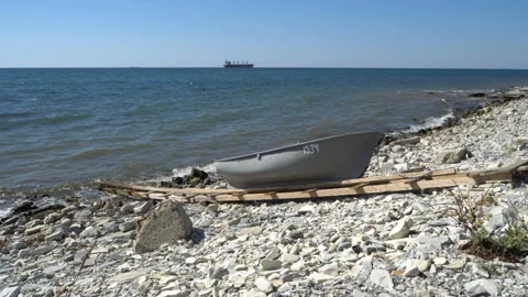 Gray boat on the seashore 4K Stock Footage 137925980