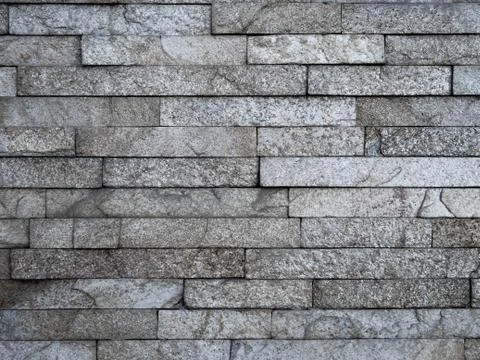 Gray brick background, dark brick wall, the black block as a background texture Stock Photos