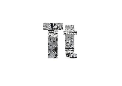 Gray brick background. Shot through the cut-out silhouette of the letter T Stock Photos