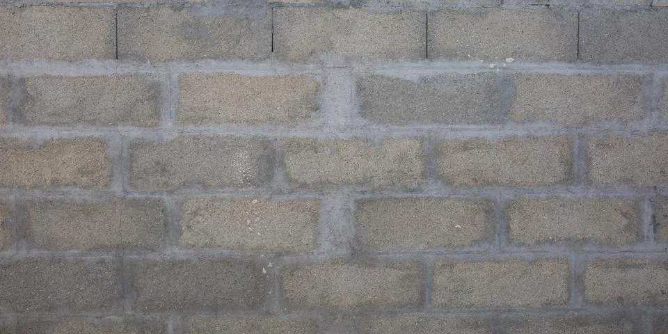 Gray brick cinder block wall background grey concrete tile cladding seamless  스톡 사진