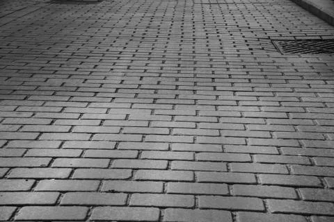 Gray Brick Stone Paved road in historic square Stock Photos