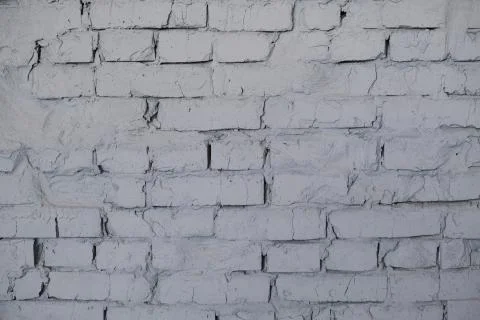 Gray brick wall and gray background indoors Stock Photos