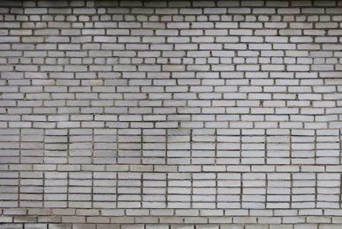 Gray brick wall background in rural area Stock Photos