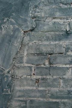 Gray brick wall background. Texture of painted brick. Stock Photos