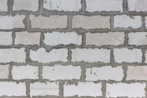 Gray brick wall with mortar joints Stock Photos