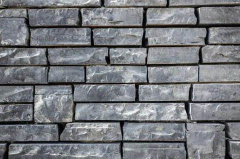 Gray brick wall with rough texture Stock-Fotos