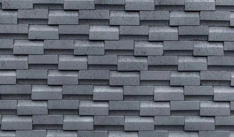 Gray brick wall with simple pattern. Gray wall texture abstract background... Stock Photos