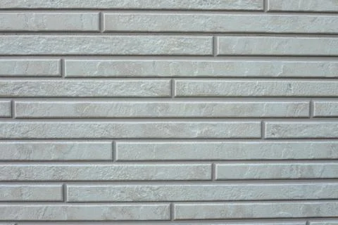 Gray brick wall texture background. Tiled. Close-up Foto stock