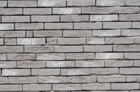 Gray brick wall texture background, stone Facade wall of a new house Foto stock