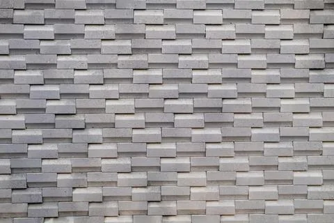 Gray brick wall with textured repeating pattern Stock Photos
