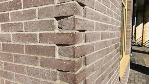 Gray brown brick and brick edge as background, texture Stock Photos