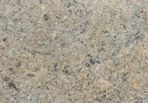 Gray, brown surface with black spots. Brown background with texture.  Stock Photos