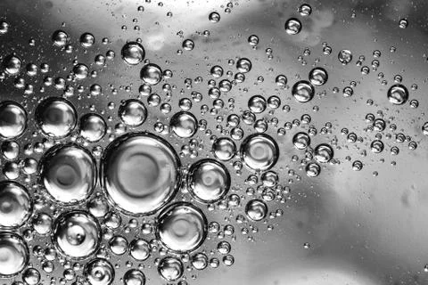 Gray bubbles of water or oil, background, texture Stock Photos