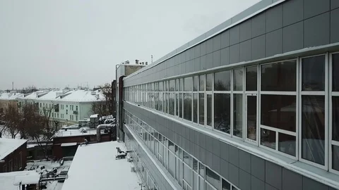 Gray building with large glass windows Stock Footage 111242746