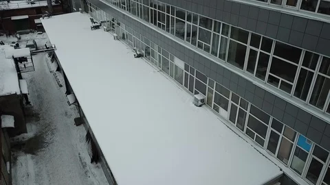 Gray building with large glass windows in winter Stock Footage 111242764