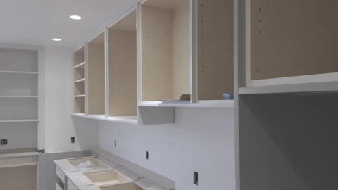 Gray Cabinetry Modern Kitchen Cabinets Installation in Progress 库存影片 335185246