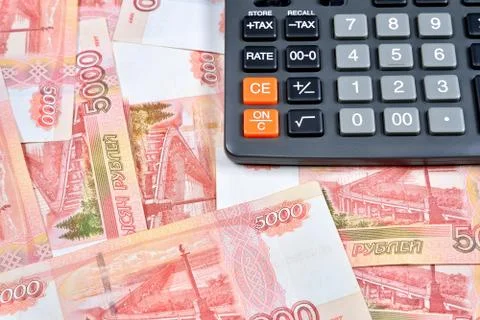 Gray calculator is on the Russian banknotes five thousand rubles Stock Photos
