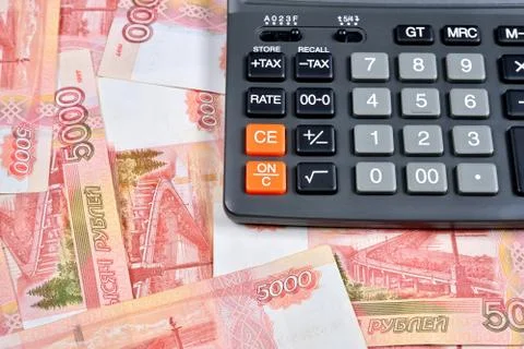 Gray calculator is on the Russian banknotes five thousand rubles Stock Photos