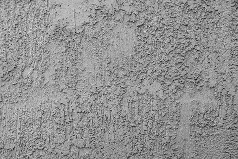 Gray cement surface with mixed rough and smooth texture patterns Stock Photos