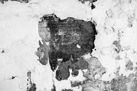 Gray cement wall with deep cracks from old age and precipitation. Blank for t Stock Photos