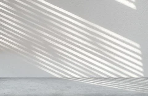 Gray cement wall in empty room with light and shadow. Stock Photos