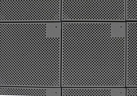 Gray ceramic abstract background with circle perforated texture Stock Photos