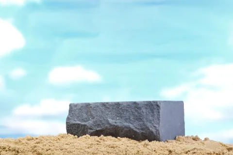 Gray ceramic bricks on the sand at the blue sky background Stock Photos