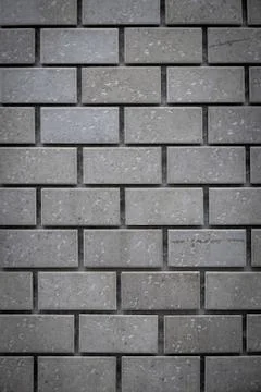 Gray ceramic bricks on the wall as background Stock Photos