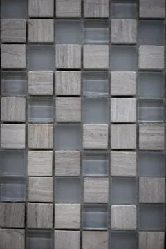 Gray ceramic mosaic on the wall as background Foto stock
