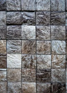 Gray ceramic mosaic on the wall as background Stock Photos