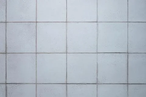 Gray ceramic tile background in a minimalist style. Interior design concept. Stock Photos