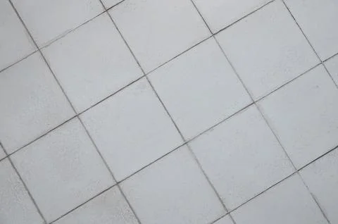 Gray ceramic tile background in a minimalist style. Interior design concept. Stock Photos