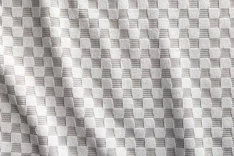 Gray checkered napkin. Tablecloth texture. Stock Photos