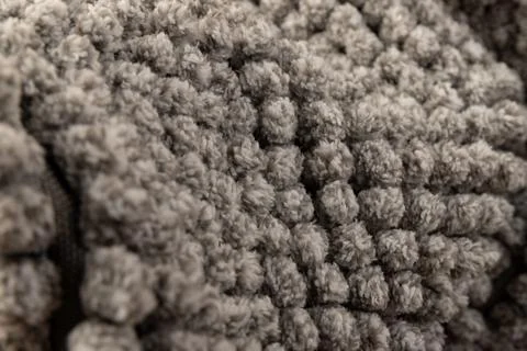 Gray chenille soft bath mat texture background. Bath Accessories. Top view. Stock Photos